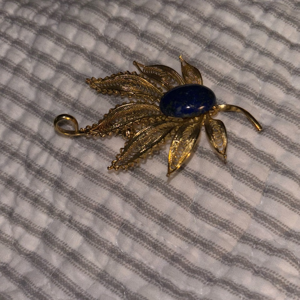 Elegant Gold Leaf Brooch with Blue Stone